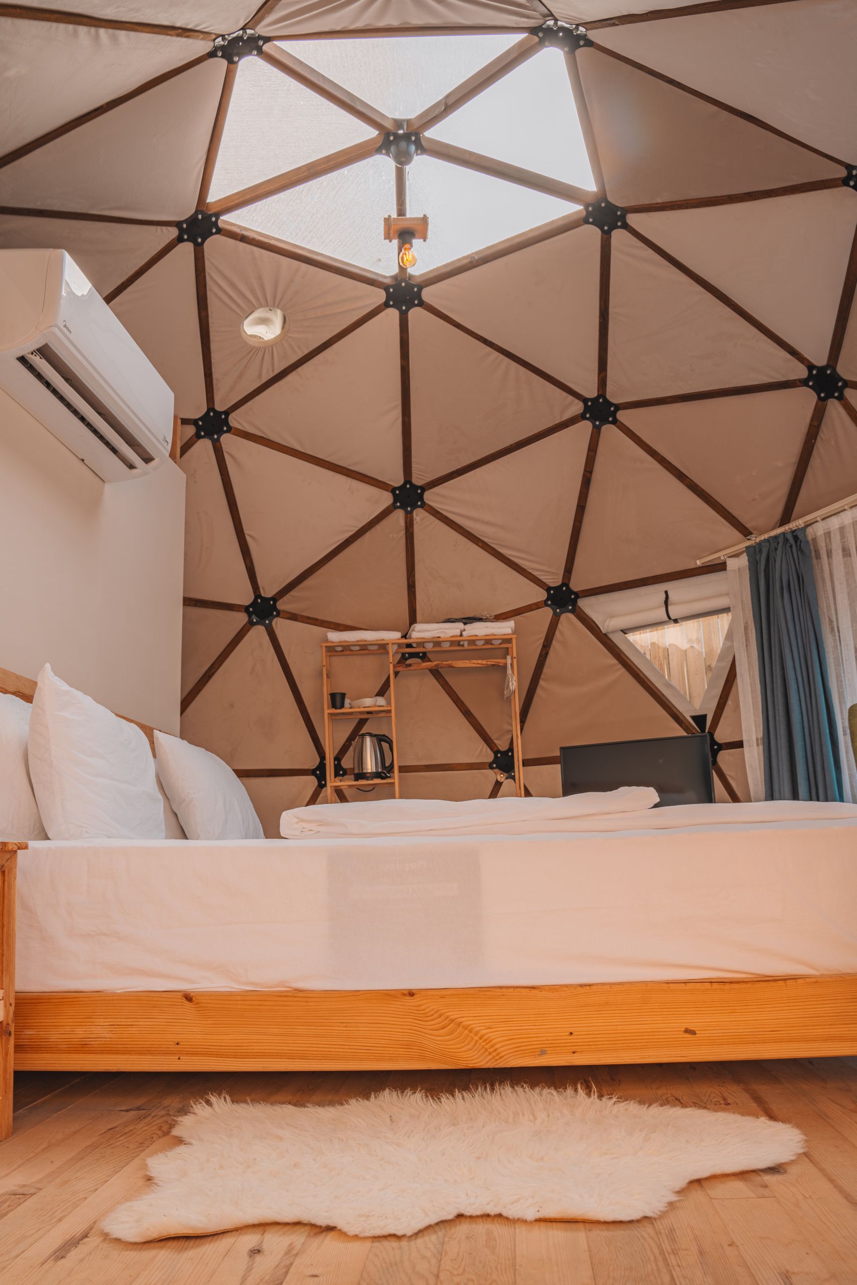 Cozy modern room inside a geodesic dome at a hotel in Antalya, Türkiye.