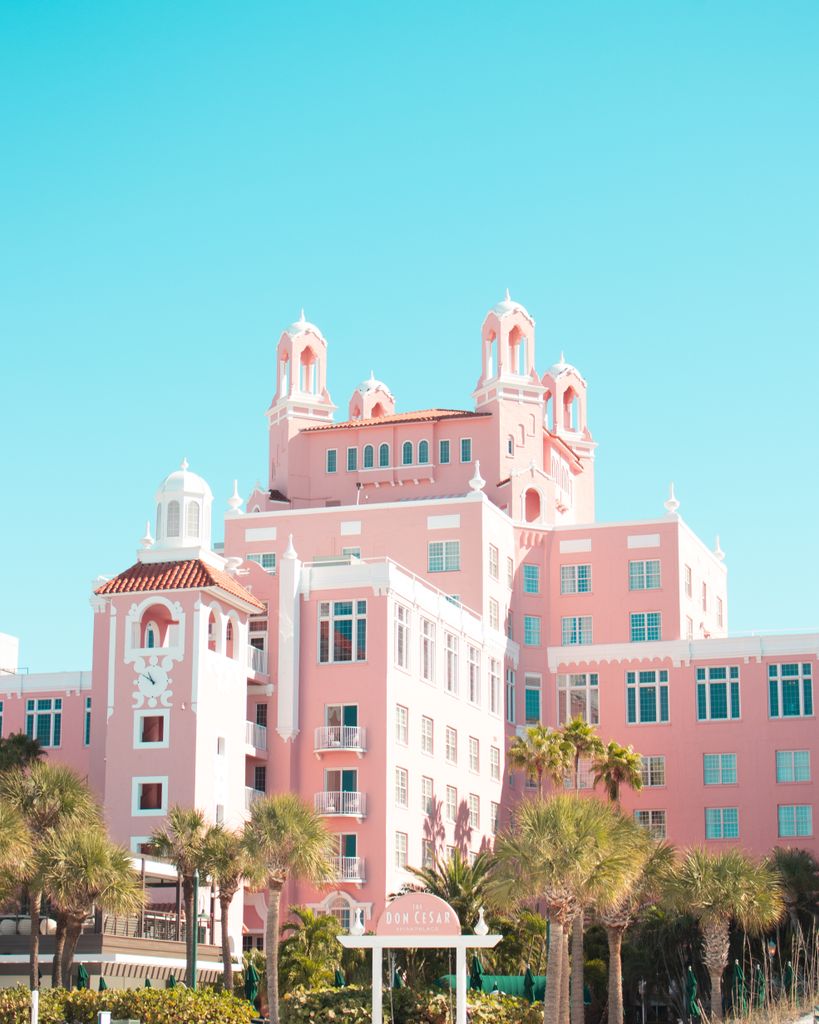 Elegant Art Deco pink hotel with palm trees in St. Petersburg, Florida, USA.